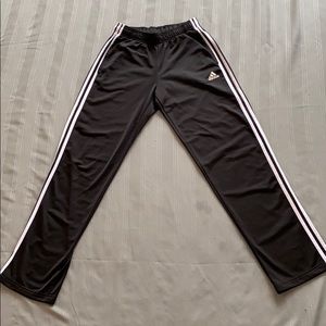 Black Adidas sweat pants.
